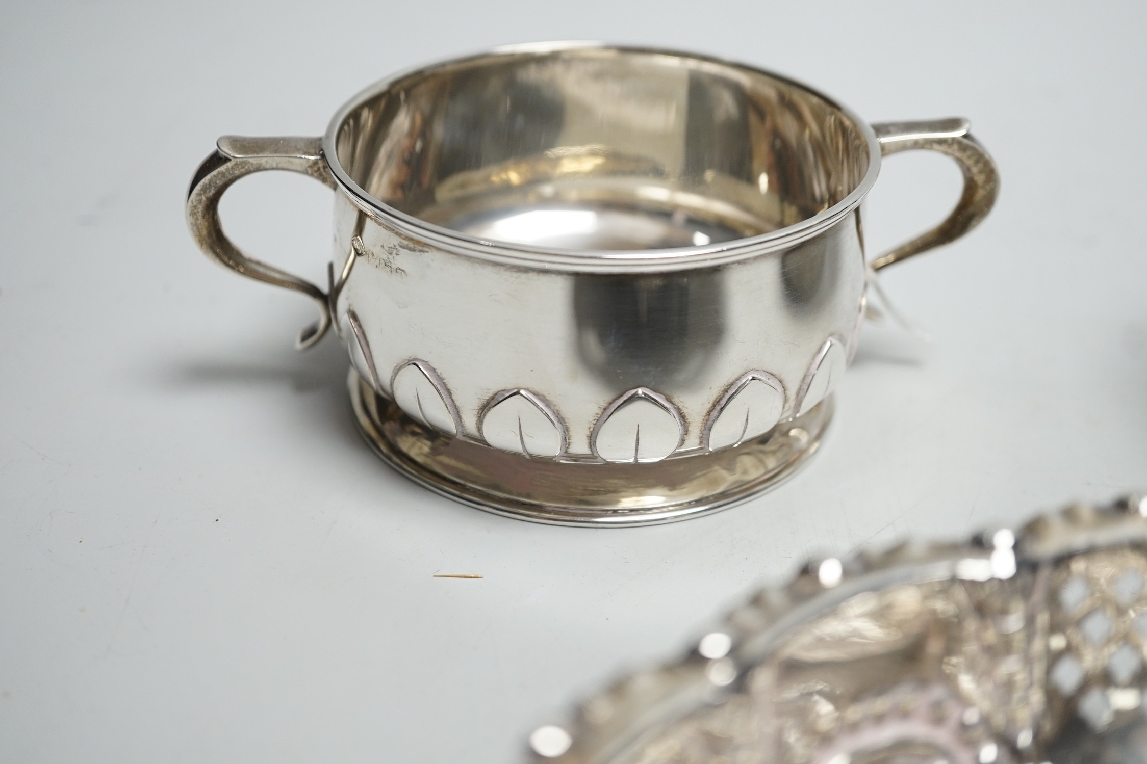 An Edwardian repousse silver shallow bowl, Birmingham, 1901, 16.1cm, together with a modern silver toilet jar and a 1920's silver two handled small bowl, 14.9oz.